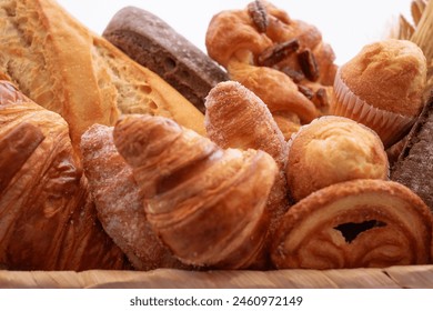 Close-up on bakery - various kinds of breadstuff. Rye bread, wholemeal, baguette, sweet bakery products and croissant - Powered by Shutterstock