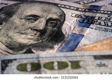 Closeup on Benjamin Franklin portrait on a one hundred US American paper banknote currency. Money for exchange. Global recession and inflation in the United States of America - Shutterstock ID 2131310365