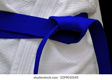 Close-up on a blue belt tied around a kimono. - Powered by Shutterstock