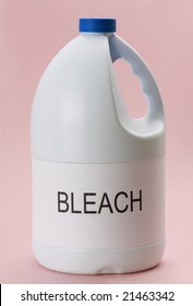closeup on bottle of laundry bleach, pink background