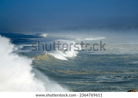 close-up on braking wave in rough sea                               