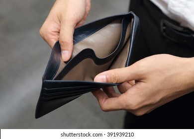 Closeup On A Businessman With Empty Wallet