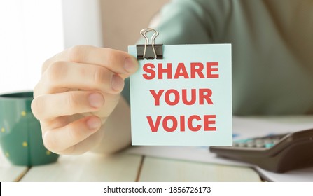 Closeup On Businessman Holding A Card With Text SHARE YOUR VOICE, Business Concept Image With Soft Focus Background And Vintage Tone