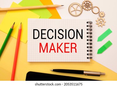 Closeup On Businessman Holding A Card With DECISION MAKER Message, Business Concept Image With Soft Focus Background And Vintage Tone