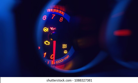 Close-up On Car Dashboard And Warning Icon