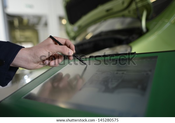 Closeup on car diagnostic\
monitor