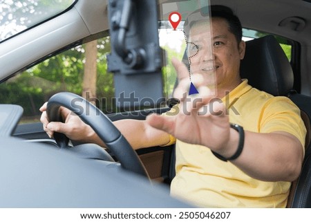 Close-up on a couple using the GPS while driving a car. Driver using GPS navigation in mobile phone while driving car at sunset. Man using mobile phone in car