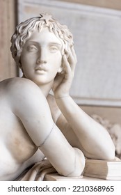Close-up on face of marble statue of beautiful woman posing 