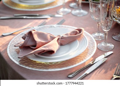 Closeup on festive served romantic table with napkins and tableware