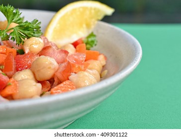 Closeup On Garbanzo Bean Salad On Green Tablecloth 