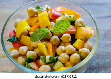 Closeup On Garbanzo Bean Salad In Transparent Glass Bowl- Healthy Eating Concept