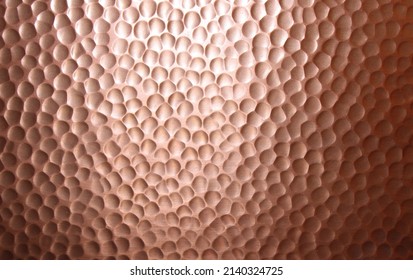 A Closeup on a Hammered Copper Surface - Shutterstock ID 2140324725