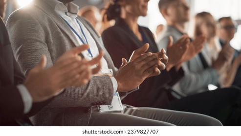 Close-Up on Hands of Audience of People Applauding in Concert Hall During Business Forum Presentation. Technology Summit Auditorium Room With Corporate Delegates. Excited Entrepreneurs Clapping. - Powered by Shutterstock