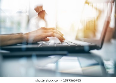 Close-up on the hands of a woman typing on a laptop keyboard. Smart working concept with double exposure effects - Shutterstock ID 1899566785