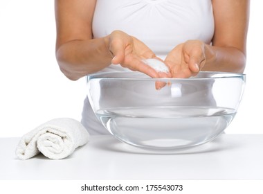 Closeup On Happy Young Woman Washing Hands In Glass Bowl With Water