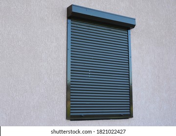 A Close-up On House Window With Outdoor Pvc Roller Blinds, Motorized Window Roller Shutters. 