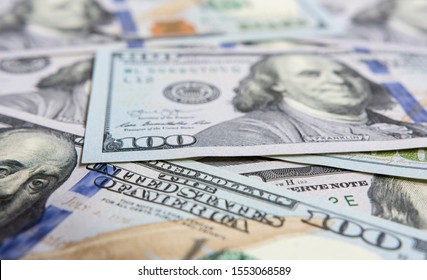 Closeup on hundred dollars bills - Shutterstock ID 1553068589