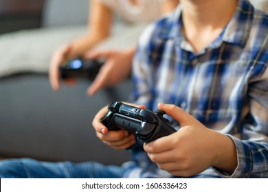 Closeup On Kids Hands Playing Console Games