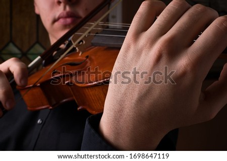 Closeup on Left Hand Playing a Viola