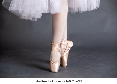 Close-up on the legs of a ballerina in ballet shoes. - Powered by Shutterstock