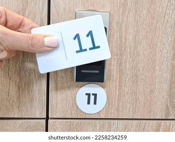 Closeup on manual locker opening in dressing room with electronic card-shaped transponder. Protecting the safety of things fitness locker room - Shutterstock ID 2258234259