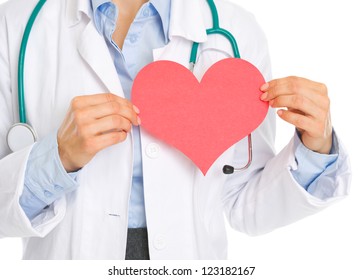 Closeup On Medical Doctor Holding Paper Heart