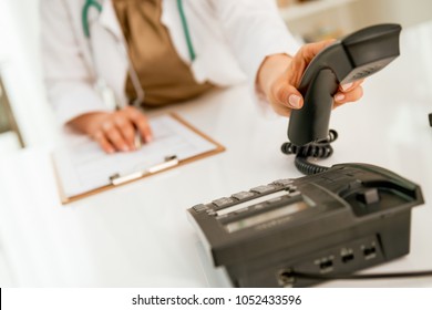 Closeup On Medical Doctor Woman Talking Phone