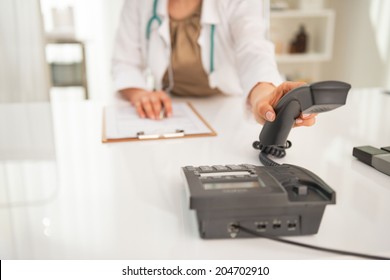 Closeup On Medical Doctor Woman Talking Phone