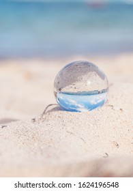 Close-up On Mini Glass Ball On The Beach 