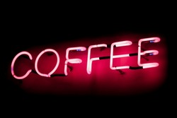 Close-up On A Neon Light Shaped Into The Word "Coffee".