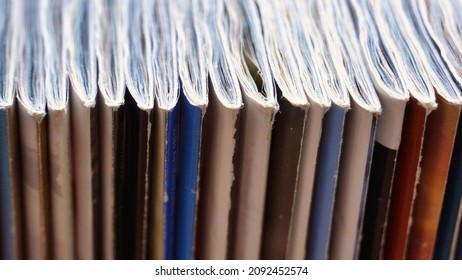 Closeup On Old Magazines In Horizontal Row. Collection, Heap, Pile, Library. Education, Learning. Magazine Spine, Cover. Typography, Edition, Paper Recycling. - 12 December 2021, Montreal, Canada