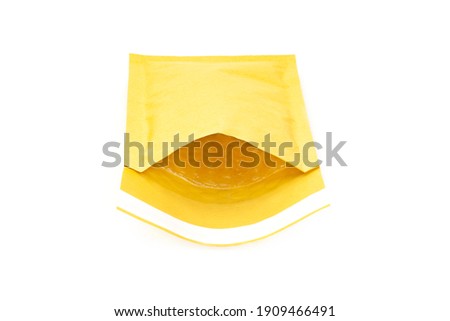 Close-up on an open padded envelope showing the internal bubble lining isolated on white.