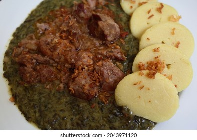 Closeup on plate of Moravsky Vrabec (Moravian Sparrow), traditional Czech Moravian dish with roast pork, dumplings and spinach.