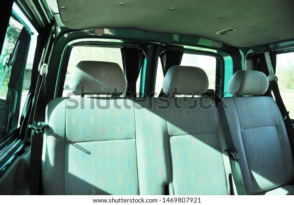 Close-up\
on the rear seats with velor upholstery in the interior of a German\
car in gray after dry cleaning. Car\
service.\
