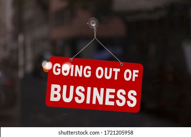 Close-up On A Red Closed Sign In The Window Of A Shop Displaying The Message 