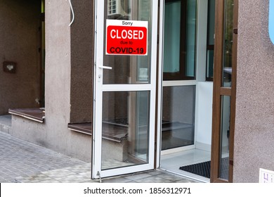 Close-up on a red closed sign in the window of a shop displaying the message Closed due to Covid-19 - Shutterstock ID 1856312971