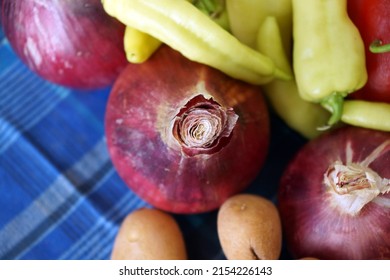 Closeup on a red onion and other harvest products - Shutterstock ID 2154226143
