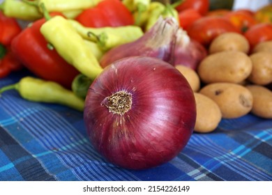 Closeup on a red onion and other harvest products - Shutterstock ID 2154226149