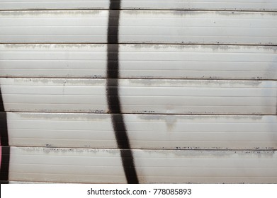 Closeup on roller shutter garage door abstract textured background