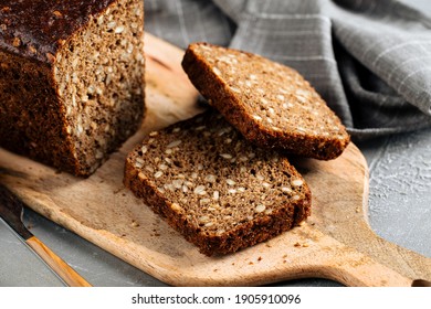 Closeup On Sliced Rye Whole Grain Bread With Seeds On The Wooden Board