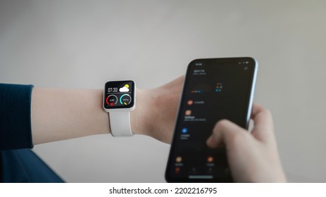 Close-up On Smart Watch Wear On Wrist Screen Show Heartbeat Tracking Technology, Walking Step, Time, Weather For  Data Health Checking With Fitness Activity App.