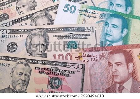 Close-up on a stack of US Dollar and Moroccan dirham.