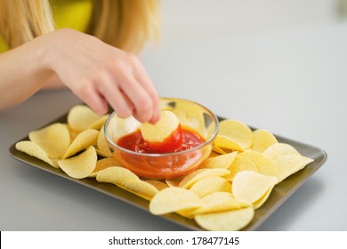 Closeup On Teenager Girl Eating Chips