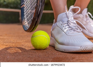 Close-up On Tennis Player On Court, Racket, Ball And Shoes