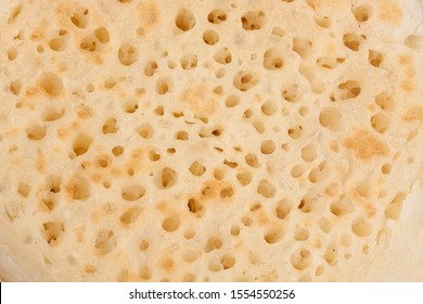 Closeup On The Texture Of A British Breakfast Crumpet