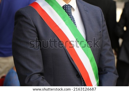 Close-up on the tricolor band of the Italian mayor. Italian politics, mayor elections