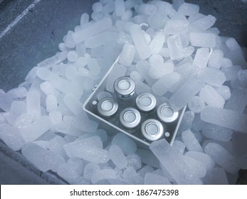 Closeup On Vials With Crimp Caps Placed On Dry Ice Prepared For Medical Transport. Selected Focus.