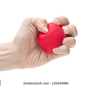 Closeup On White Background Of Male Hand With Tight Strong Grip Applying Pressure On Red Ball