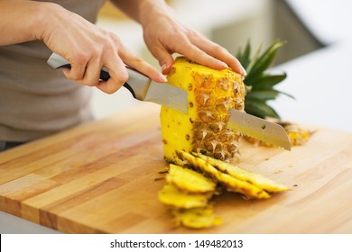 Closeup on woman cutting pineapple - Powered by Shutterstock