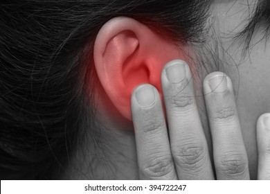 Close-up On Woman Hand Touch Her Ear With Pain